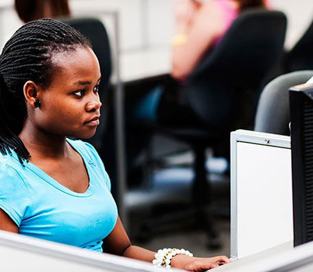 Young woman working in a computer lab