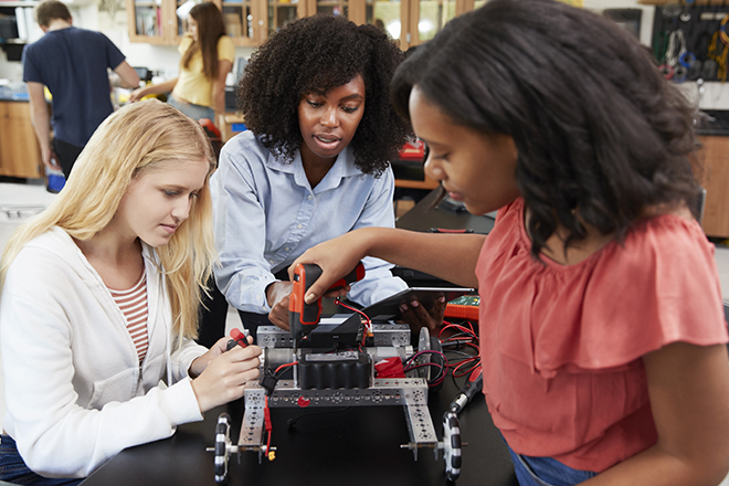Women working together on a STEM project