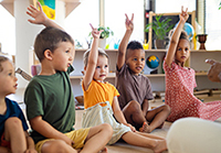 Photo: raising hands in class