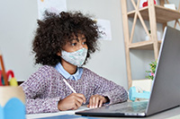 Photo of student working on a computer